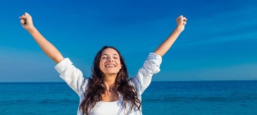 Woman happy arms up