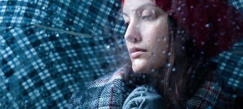 woman with blues in rain