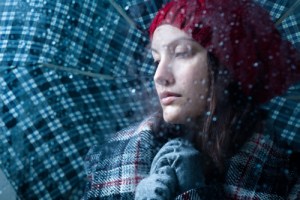 woman with blues in rain